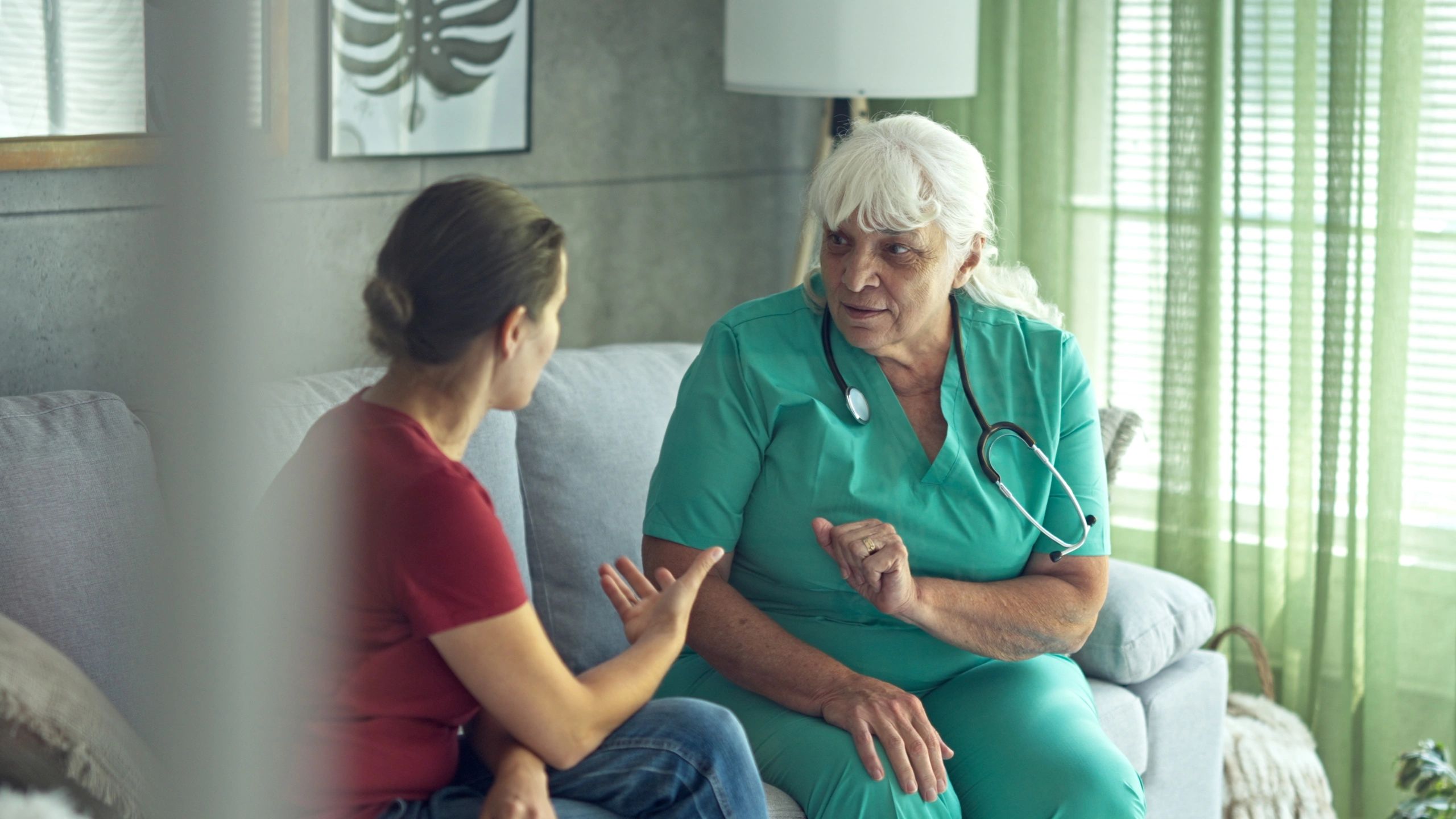 Support professional visiting a client in a home setting