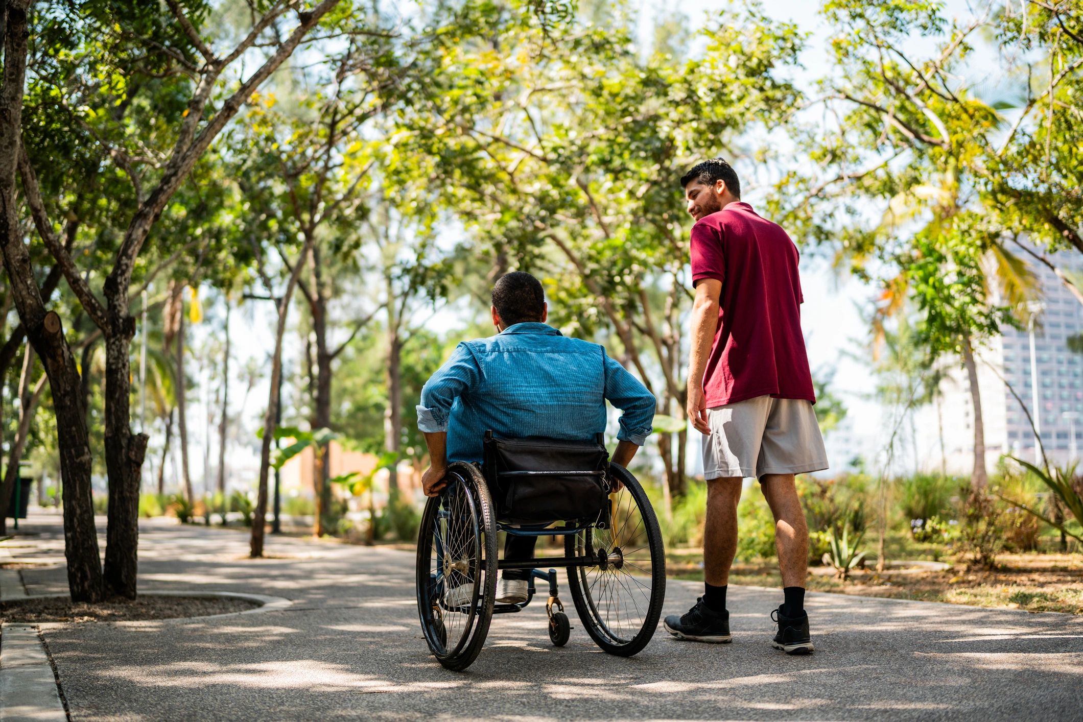 Adults walking together outdoors with supportive companionship