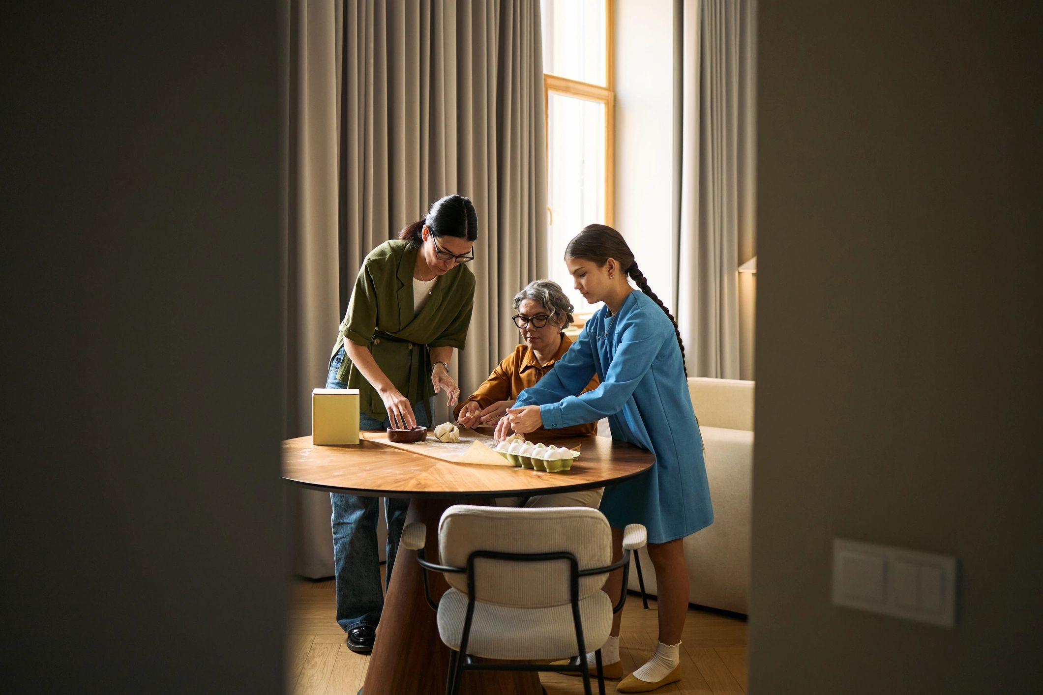 Caregiver and adult working together on a daily living activity